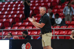 Indiana coach Darian DeVries claps on the sideline.