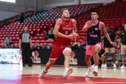 Tucker DeVries drives to the basket.