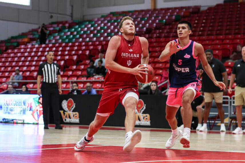 Tucker DeVries drives to the basket.
