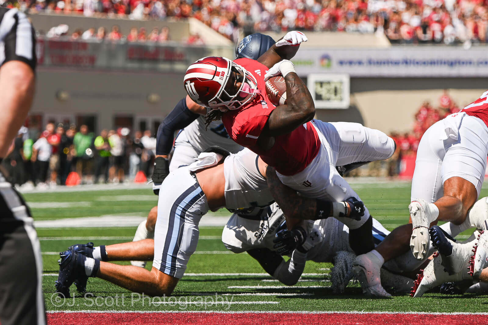 An IU running back stretches towards the endzone.