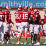 IU football quarterback Fernando Mendoza in the huddle.
