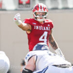 IU football linebacker Aiden Fisher directs the defense.