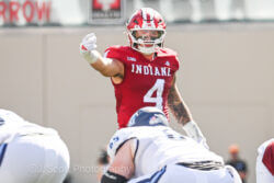 IU football linebacker Aiden Fisher directs the defense.