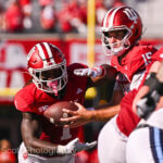 IU football quarterback Fernando Mendoza hands off the ball.