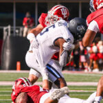 An IU football player tackles an Old Dominion player.
