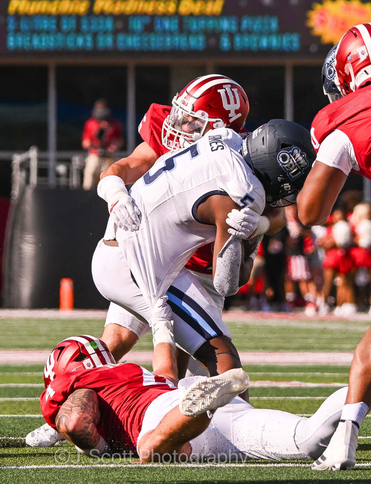 An IU football player tackles an Old Dominion player.