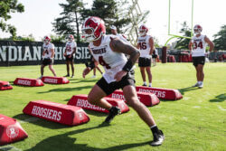 Indiana linebacker Aiden Fisher goes through drills at practice.