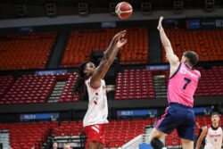 Lamar Wilkerson attempts a jump shot.