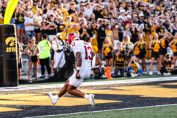 Elijah Sarratt scores a touchdown at Iowa.