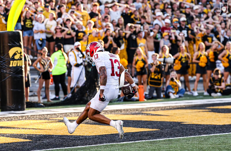 Elijah Sarratt scores a touchdown at Iowa.