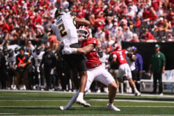 Aiden Fisher makes a tackle.