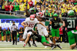 Fernando Mendoza rushes the ball against Oregon.