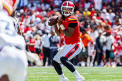 Maryland quarterback Malik Washington gets ready to throw a pass.