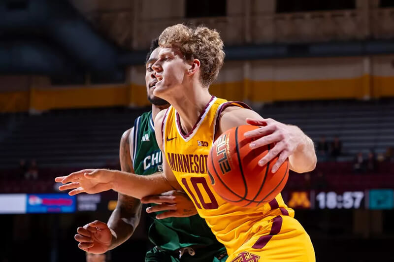 Minnesota wing Cade Tyson handles the ball.
