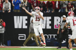 Fernando Mendoza attempts a pass.