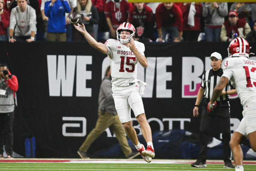 Fernando Mendoza attempts a pass.