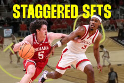 Conor Enright drives the basketball.