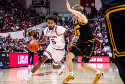 Tayton Conerway drives to the basket against Iowa.