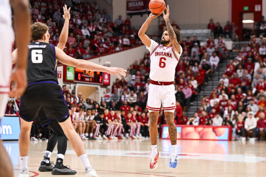 Tayton Conerway takes a shot from deep against Washington.