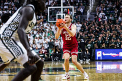 Tucker DeVries attempts a 3-pointer.