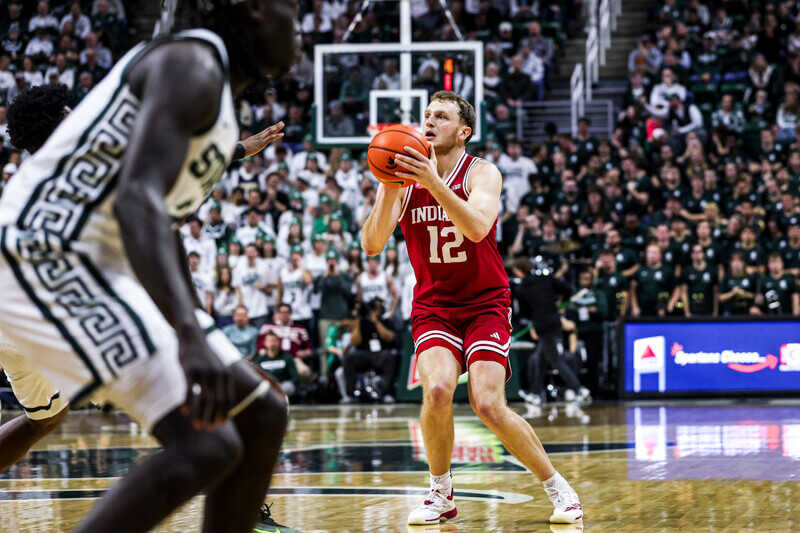 Tucker DeVries attempts a 3-pointer.