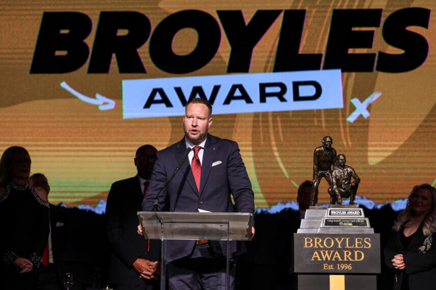 Bryant Haines accepts the Broyles Award.