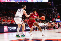 Sam Alexis drives towards the basket.