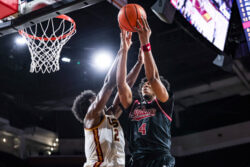 Sam Alexis goes for a rebound at USC.
