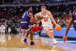 Tucker DeVries drives to the basket.