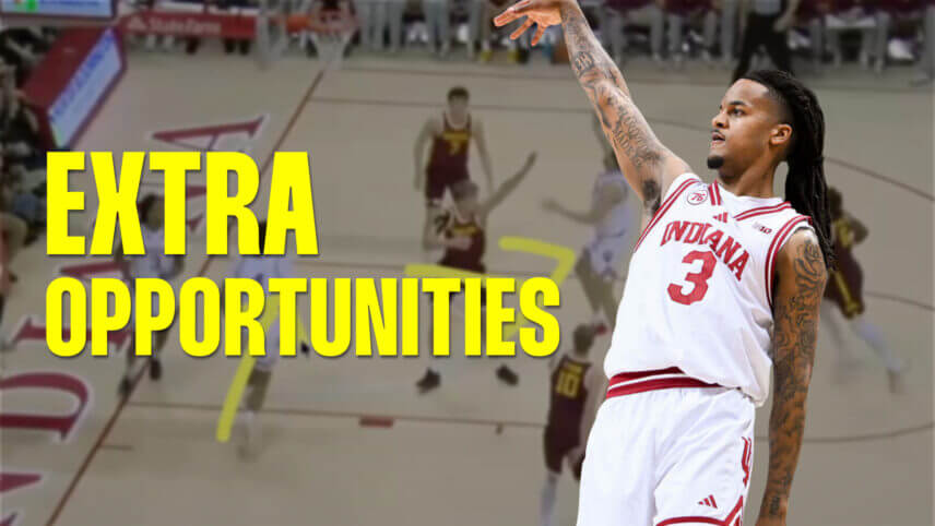 Lamar Wilkerson watches his shot with his arm raised.