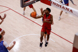Jaeden Mustaf attacks the rim at an IU basketball practice.