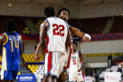 Jaeden Mustaf and Aiden Sherrell celebrate a play in the FISU America Games.