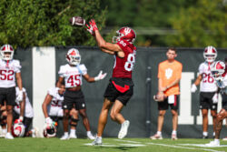 Charlie Becker catches a pass at IU football practice.