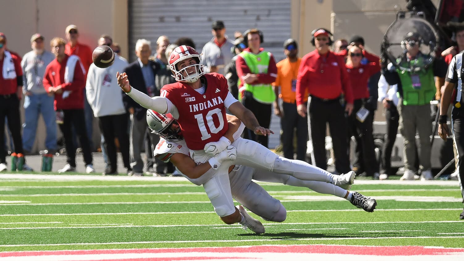 Josh Hoover attempts a pass against Ohio State.