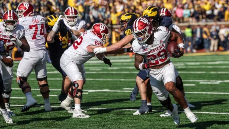 Lee Beebe Jr rushes the ball at Michigan.