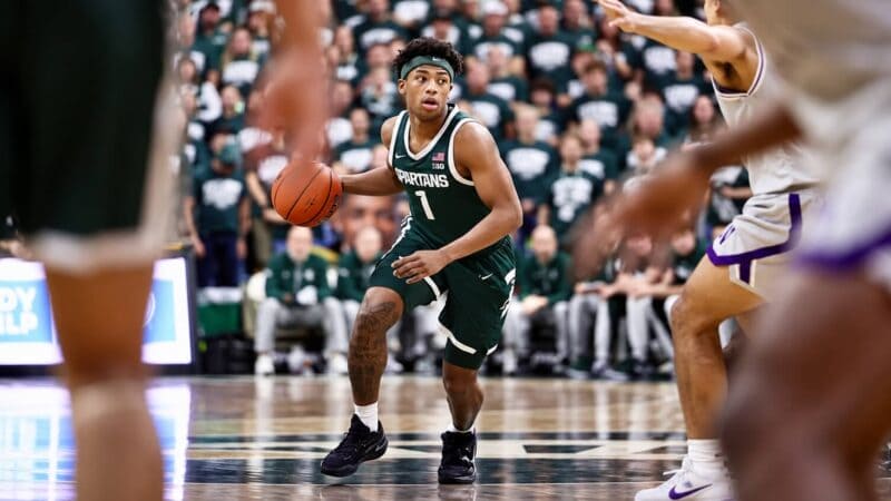 Jeremy Fears handles the ball.