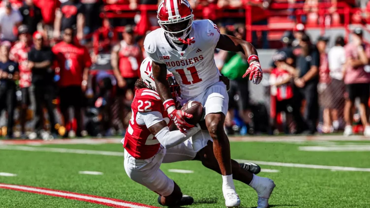 Nick Marsh runs with the ball as IU football takes on Nebraska.